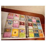 Binder of 9+0 Pokemon trading cards