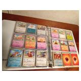 Binder of 9+0 Pokemon trading cards