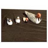 Wood, plastic, and ceramic duck figurines
