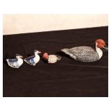 Wood, plastic, and ceramic duck figurines