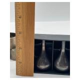 Pair of Dansk IHQ Candleholders and 9 Brushed Metal Napkin Rings