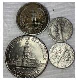 Three Silver Coins and Half Dollar