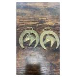 2 brass racing horse themed medallions