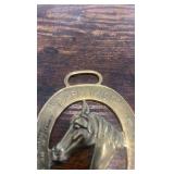 2 brass racing horse themed medallions