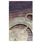 2 brass racing horse themed medallions