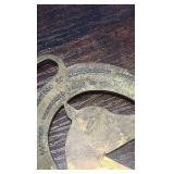 2 brass racing horse themed medallions