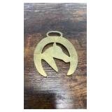 2 brass racing horse themed medallions