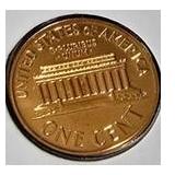 1963 Franklin Half Dollar, graded MS-69, plus four pennies from 1961 and 1963 with varying grades and defects.