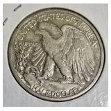 1942-D Half Dollar, graded AU (About Uncirculated).