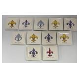 A & B Home Fleur-de-Lis Finial on Pedestal with 11 Creative Co-op Small Plates