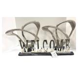 Two Abstract Metal Sculptures and Welcome Sign