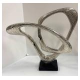 Two Abstract Metal Sculptures and Welcome Sign