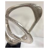 Two Abstract Metal Sculptures and Welcome Sign