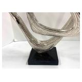 Two Abstract Metal Sculptures and Welcome Sign