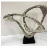 Two Abstract Metal Sculptures and Welcome Sign