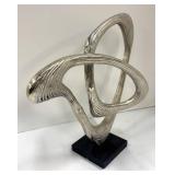 Two Abstract Metal Sculptures and Welcome Sign