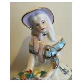 LL - 7-Inch Porcelain Figurine - Woman in Tiered Floral Dress With Bouquet