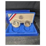 United States Liberty Coins 1986 - Ellis Island Silver Dollar & Statue of Liberty Half Dollar (Lot of 2)