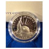 United States Liberty Coins 1986 - Ellis Island Silver Dollar & Statue of Liberty Half Dollar (Lot of 2)