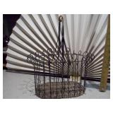 The image shows two vintage metal baskets,