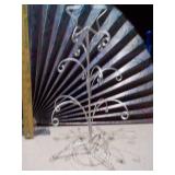 These are various metal wire ornament or jewelry display stands,