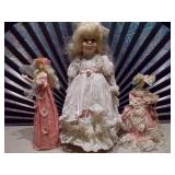 a collection of porcelain dolls