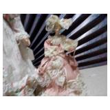 a collection of porcelain dolls