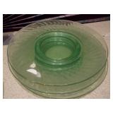 The image displays various sets of vintage green glass plates and bowls,