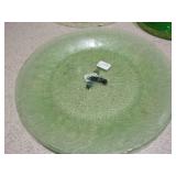 The image displays various sets of vintage green glass plates and bowls,
