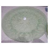 The image displays various sets of vintage green glass plates and bowls,