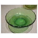 This collection features various vintage green glass items, likely from the Mid-Century Modern (1950s-1970s) or Depression glass (1920s-1940s) eras.