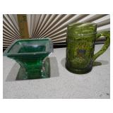 This collection features various vintage green glass items, likely from the Mid-Century Modern (1950s-1970s) or Depression glass (1920s-1940s) eras.