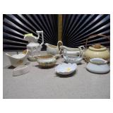 The image displays an assortment of vintage porcelain and pottery collectibles