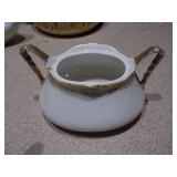 The image displays an assortment of vintage porcelain and pottery collectibles