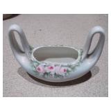 The image displays an assortment of vintage porcelain and pottery collectibles