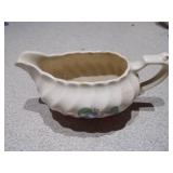 The image displays an assortment of vintage porcelain and pottery collectibles