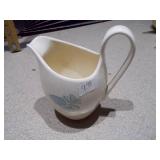 The image displays an assortment of vintage porcelain and pottery collectibles