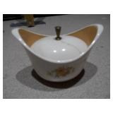 The image displays an assortment of vintage porcelain and pottery collectibles