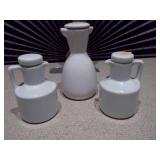 This appears to be a vintage white ceramic oil and vinegar set