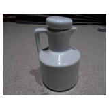 This appears to be a vintage white ceramic oil and vinegar set