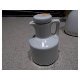 This appears to be a vintage white ceramic oil and vinegar set