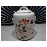 The item pictured is a vintage McCoy pottery cookie jar