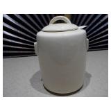 The item pictured is a vintage McCoy pottery cookie jar