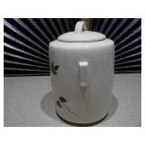 The item pictured is a vintage McCoy pottery cookie jar