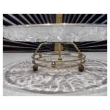 This is a vintage Federal Glass "Leaf and Dot" pattern clear glass lazy susan relish tray with an attached gold-tone footed stand.