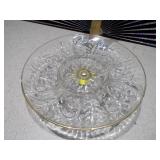 This is a vintage Federal Glass "Leaf and Dot" pattern clear glass lazy susan relish tray with an attached gold-tone footed stand.
