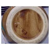 This is a vintage stoneware bean pot with a lid and handles.