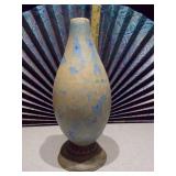 This is a handmade porcelain vase with a blue and rust crystalline glaze