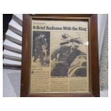 These are framed vintage newspaper clippings or movie lobby cards