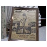 These are framed vintage newspaper clippings or movie lobby cards